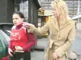2 lesbians drinking piss in street
