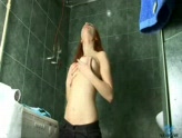 Awesomely hot redhead showering her long sexy pussy slit.