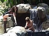 Lesbians in lingerie licking wet pussy at a waterfall