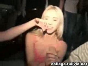College teen girls get on their knees and share sucking cock at a party.