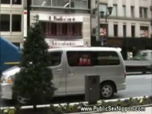 Asian has modeling clay pressed up against her ass whille sticking her head out of the window of a van