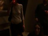 Brunette college girl sucks cock in front of a frat house party.