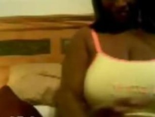Busty black MILF dildoing her horny pussy on webcam