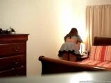 young teen toying with dildo on her bed