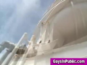 Hot video of an exhibitionist gay blowjob in public on a rooftop