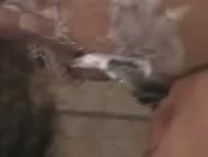 This 18 year old Japanese girls likes to keep her pussy bald. Watch her shave it in the shower and plays with it as she attempts to pee.